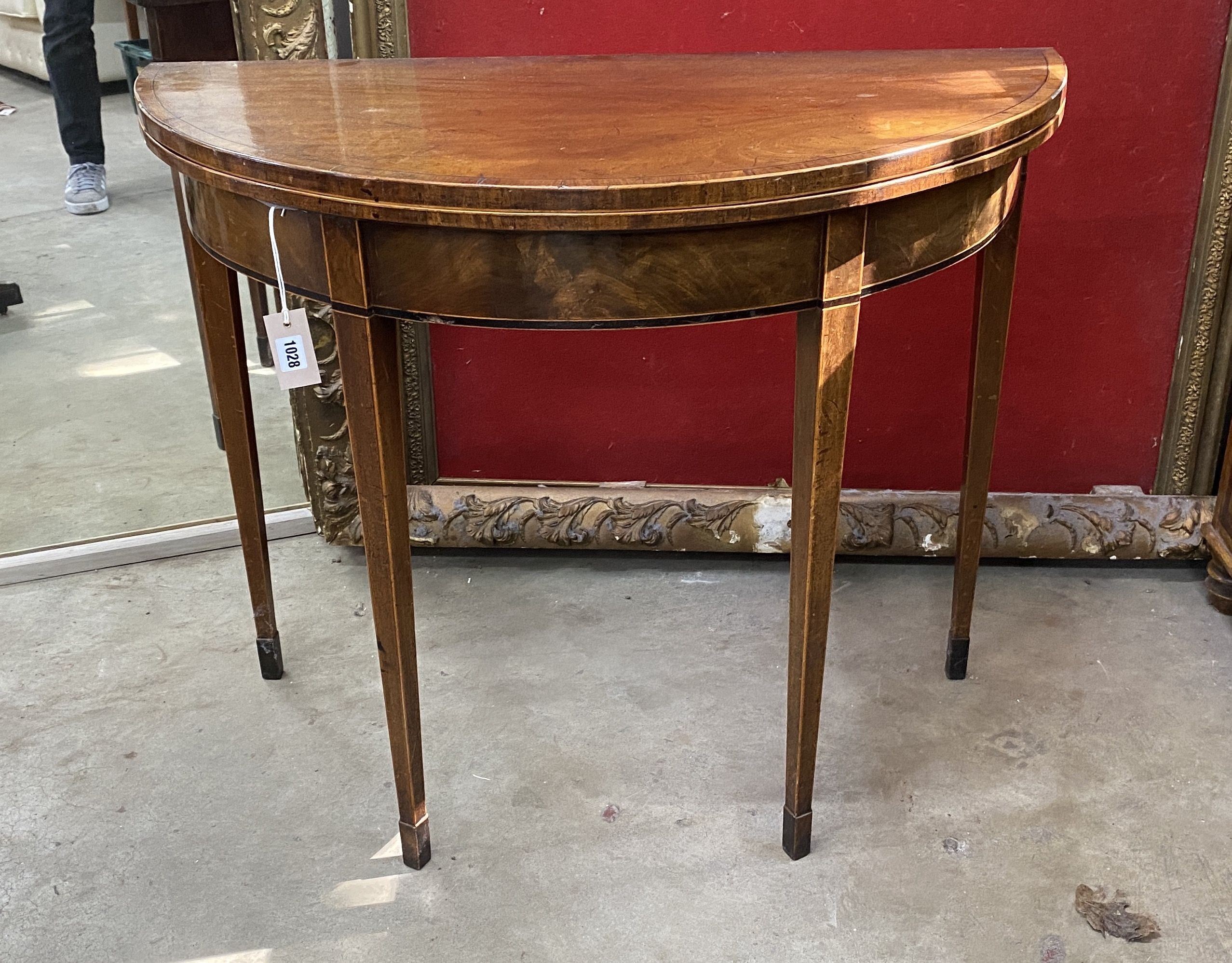 A George III satinwood banded mahogany D shaped folding card table, width 92cm, depth 45cm, height 74cm